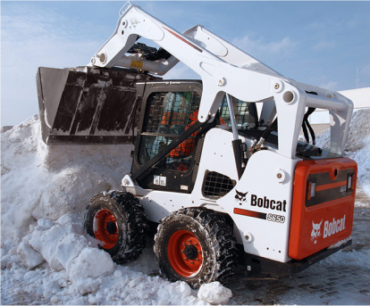 bobcat working at removal snow from parking lot